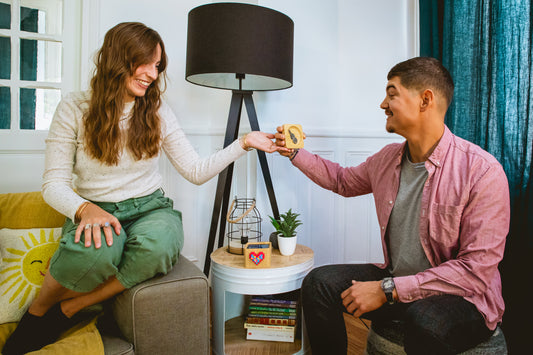 Woman handing a Lovebox to her husband.