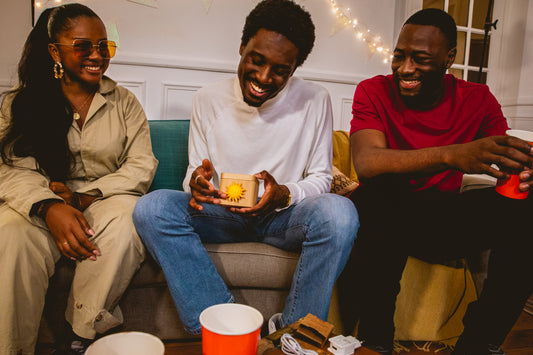 Group of friends looking at a Lovebox gift together.