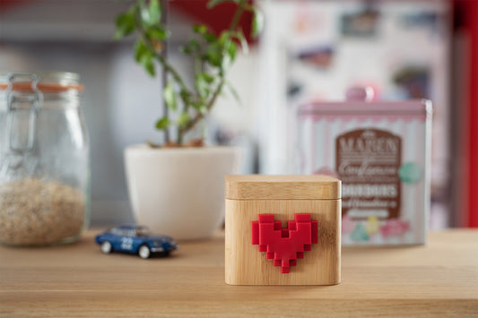 Wooden lovebox sitting on a kitchen countertop.