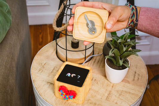 A wooden lovebox with keys hidden in the compartment underneath.